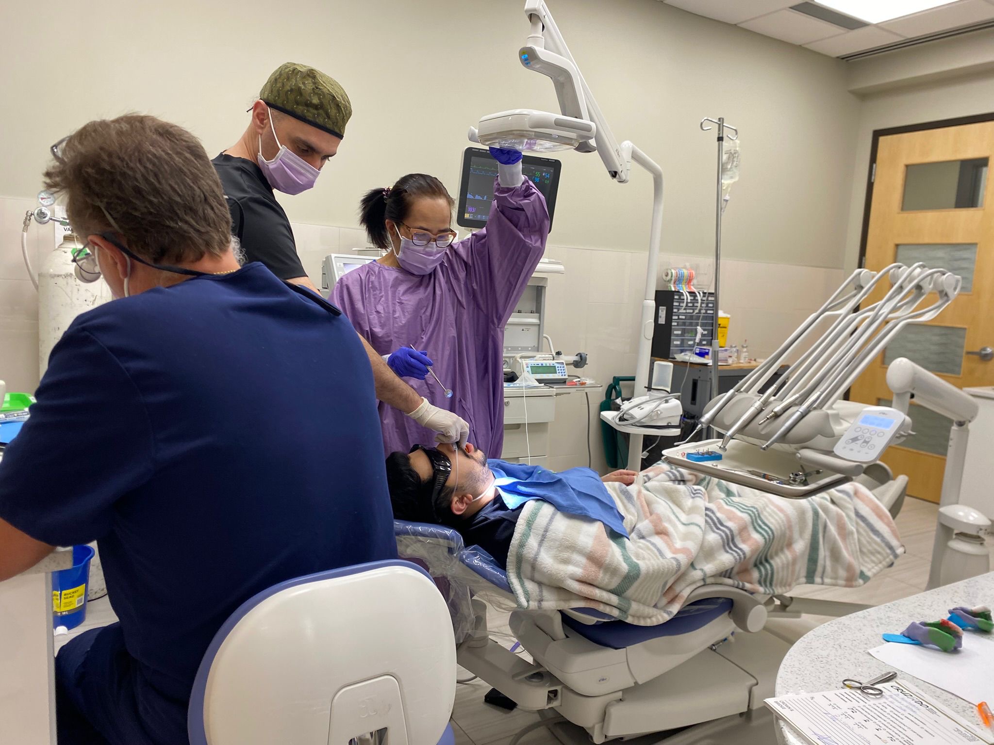 The full clinical team in action at Dental Sedation Ottawa's GA suite