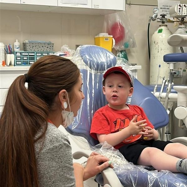 Parent comforting child at dentist